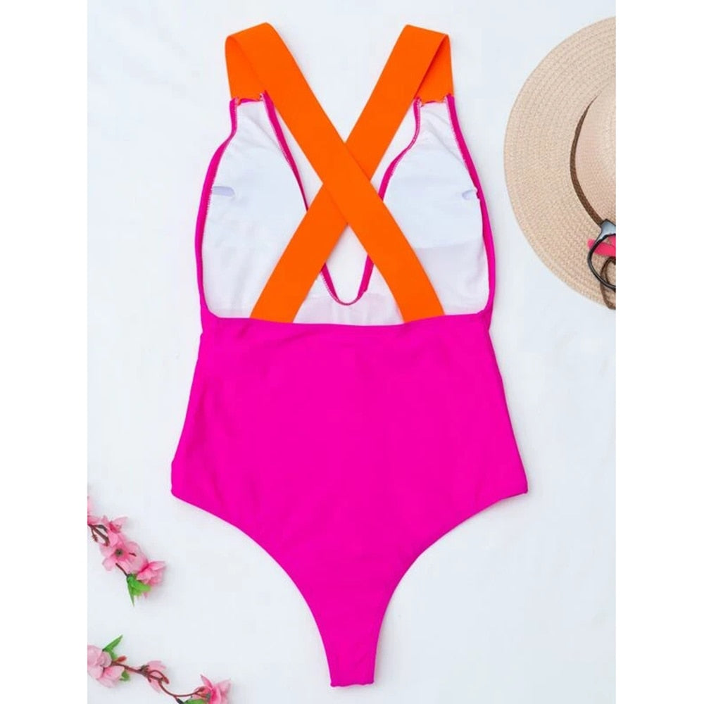 Pink patchwork cross-back one-piece swimsuit from The Clothing Company Sydney, featuring a stylish monokini design for summer beachwear.
