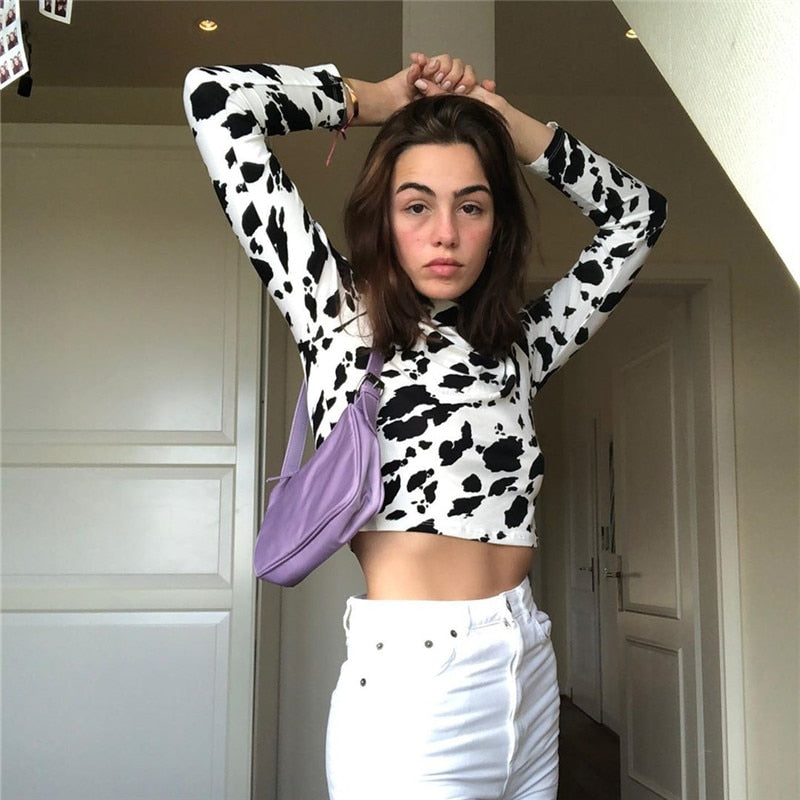 Cow print pattern crop top from The Clothing Company Sydney featuring long sleeves and slim fit casual streetwear style.