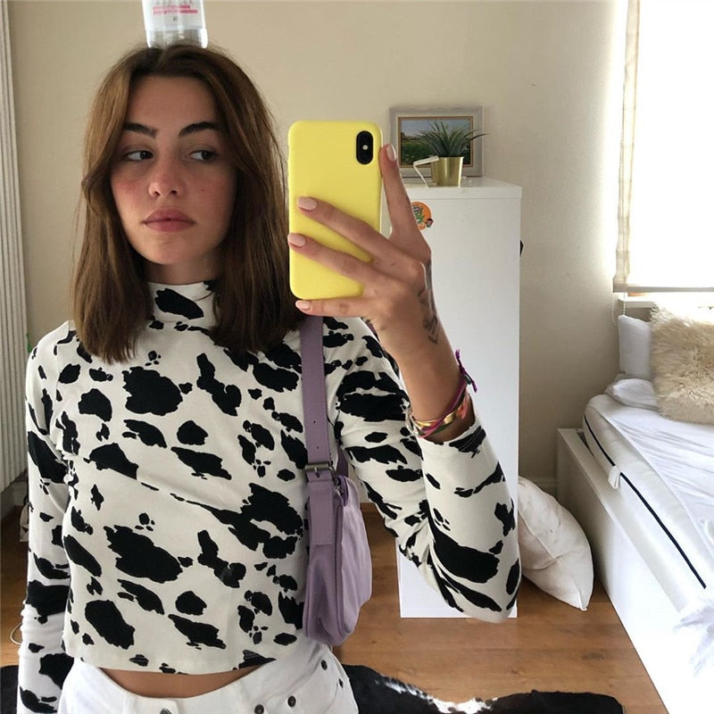 Cow print pattern long sleeve crop top by The Clothing Company Sydney, slim fit casual streetwear shirt for holiday fashion.