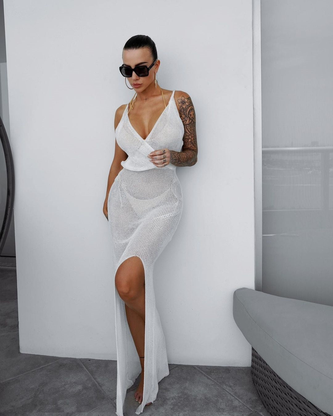 Crochet beach maxi dress by The Clothing Company Sydney, see-through, plunging backless design, sleeveless with lacing and split details.