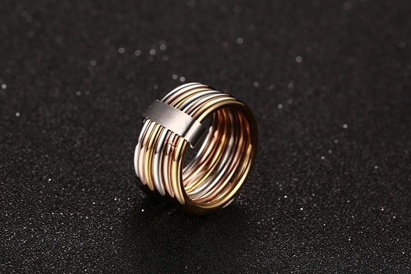 Stacked wide statement cocktail rings with interlocked plain bands in three colors, designed for women by The Clothing Company Sydney.