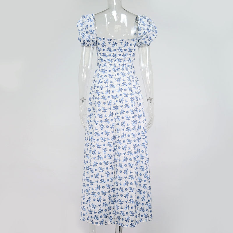 Elegant floral print short sleeve split dress by The Clothing Company Sydney, showcasing a stylish design with a fitted bodice and flowing skirt.