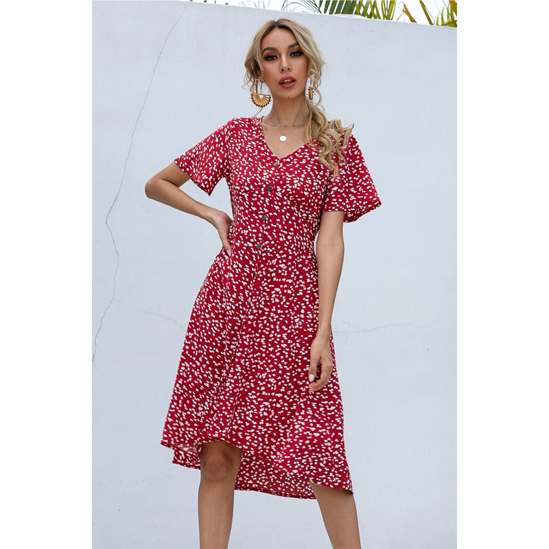 Summer midi dress by The Clothing Company Sydney featuring V-neck, printed fabric, single row buttons, high waist, and irregular hem.