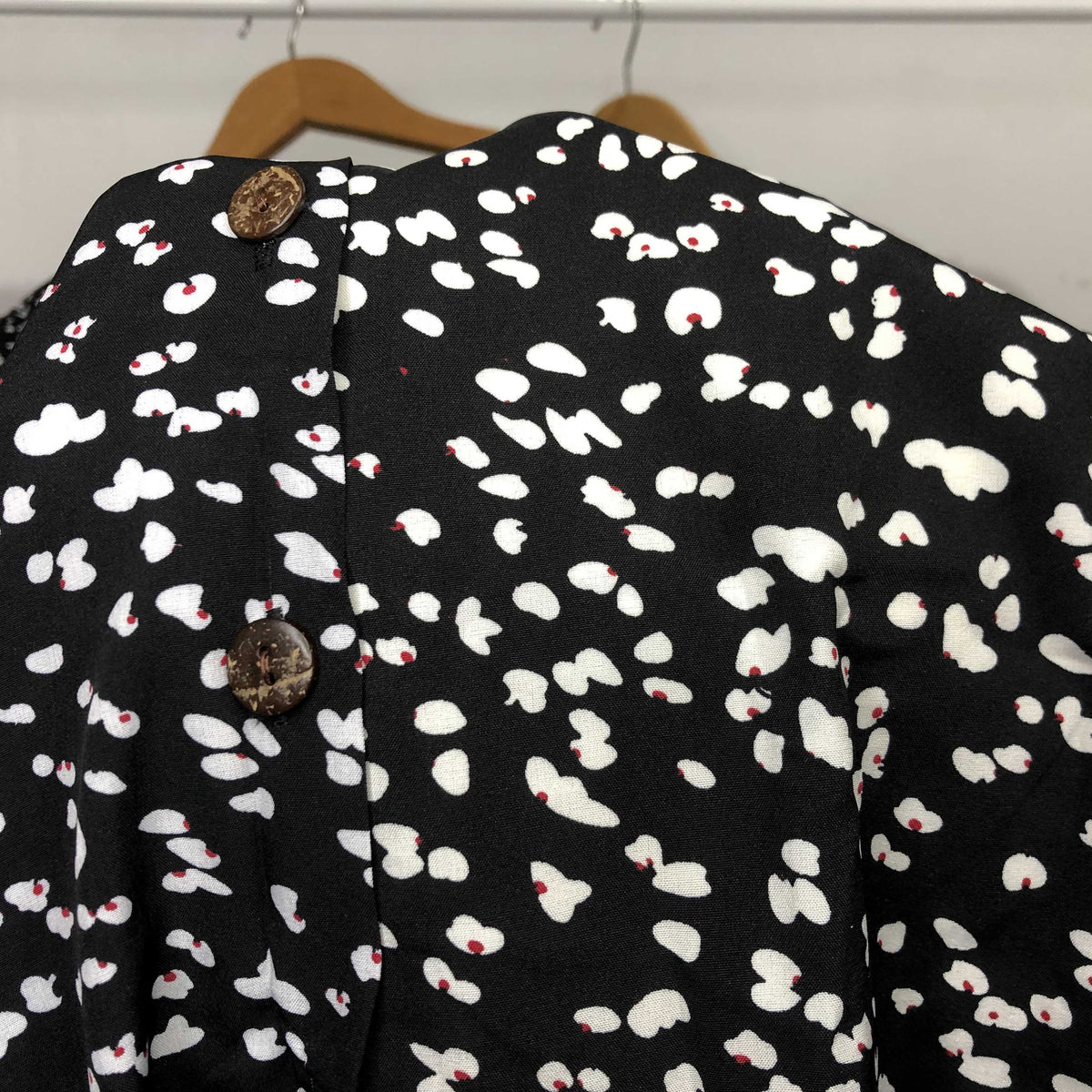 Summer midi dress from The Clothing Company Sydney featuring a V-neck, printed pattern, single row buttons, and high waist fit.