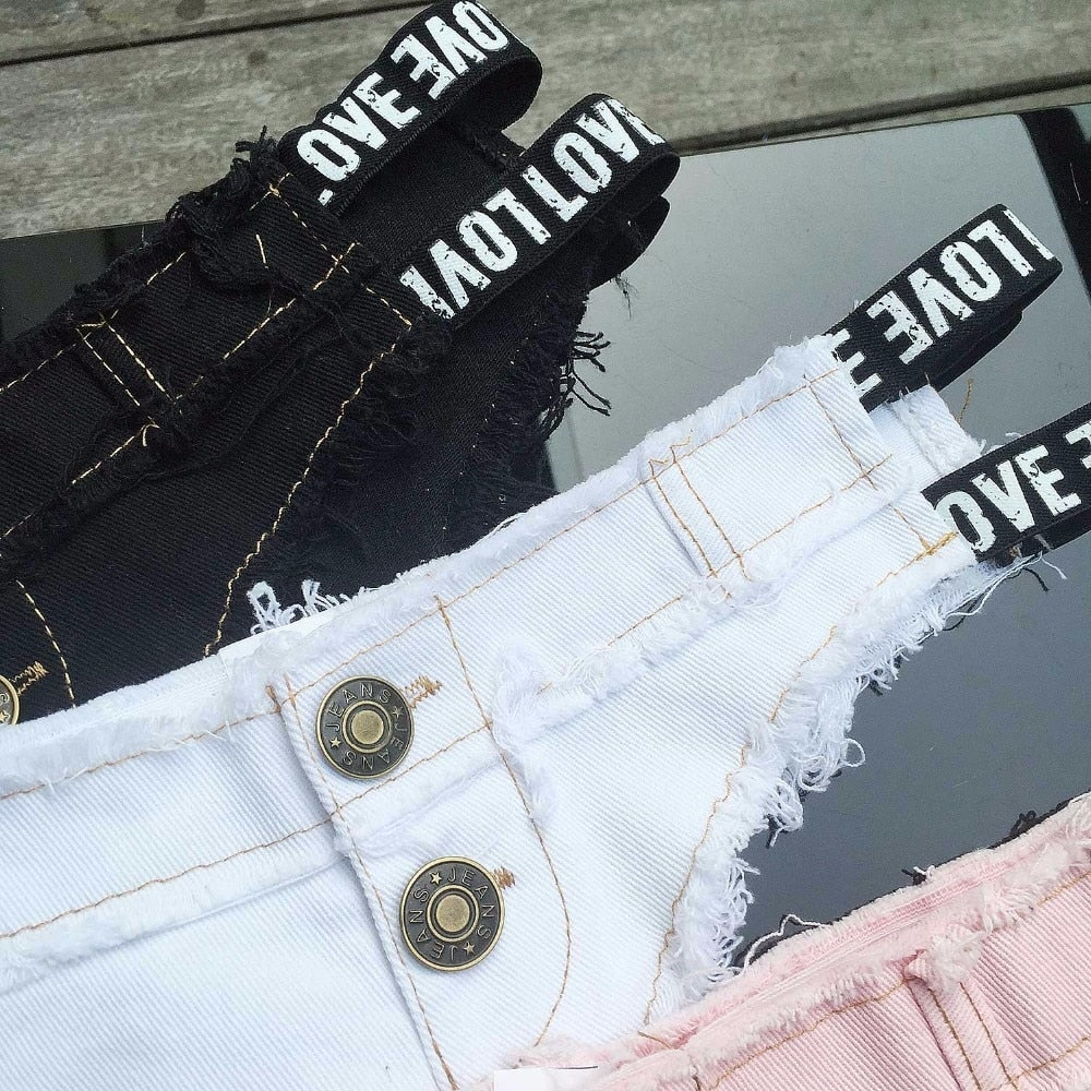 Black low-waist denim shorts for women featuring a super short style, perfect for streetwear or beach casual looks.