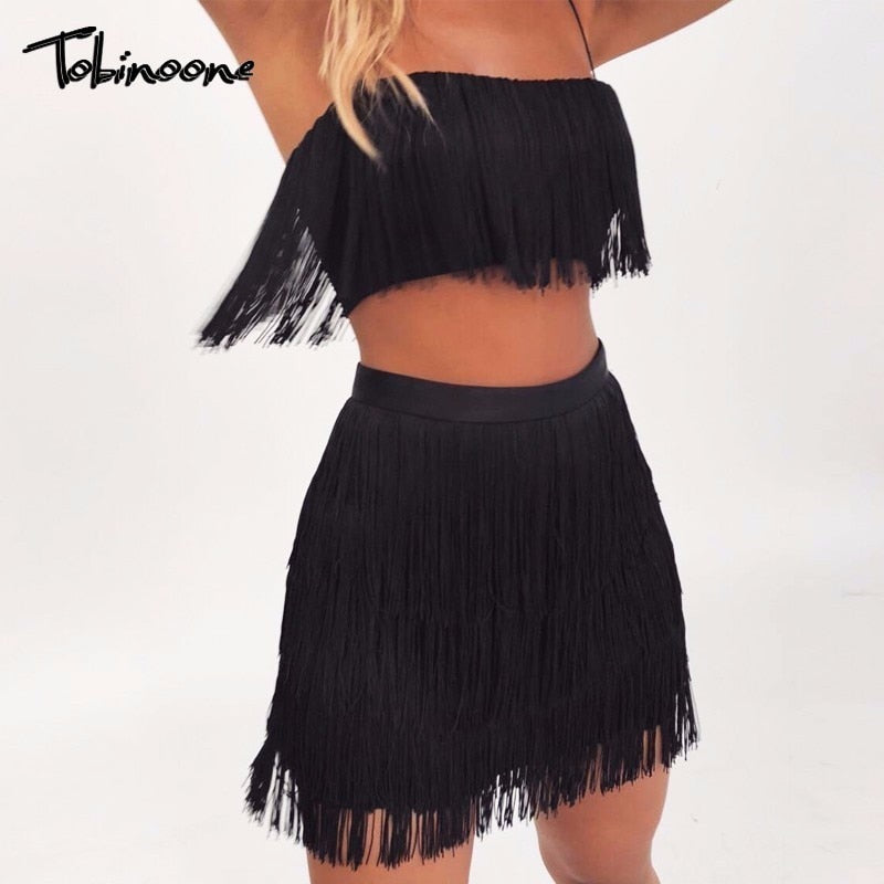 Elegant off-shoulder mini dress with tassel embellishments and fringe details from The Clothing Company Sydney, perfect for summer parties.