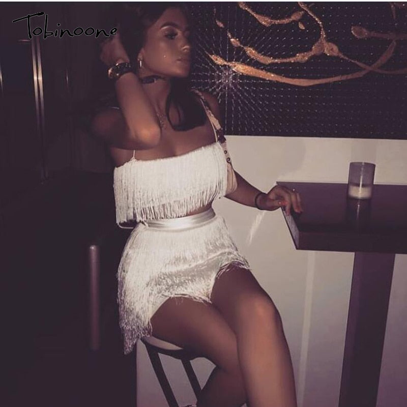 Elegant off-shoulder mini dress with tassel embellishments, designed for summer club parties, by The Clothing Company Sydney.