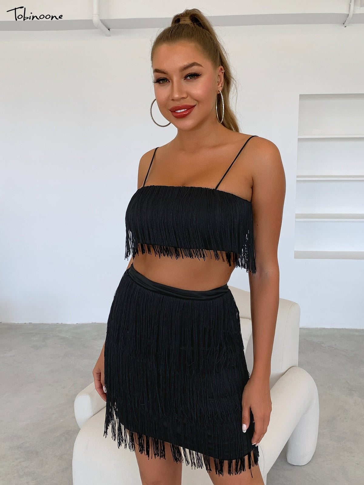 Elegant 2-piece summer tassel dress by The Clothing Company Sydney featuring off-shoulder design and mini fringe embellishments.