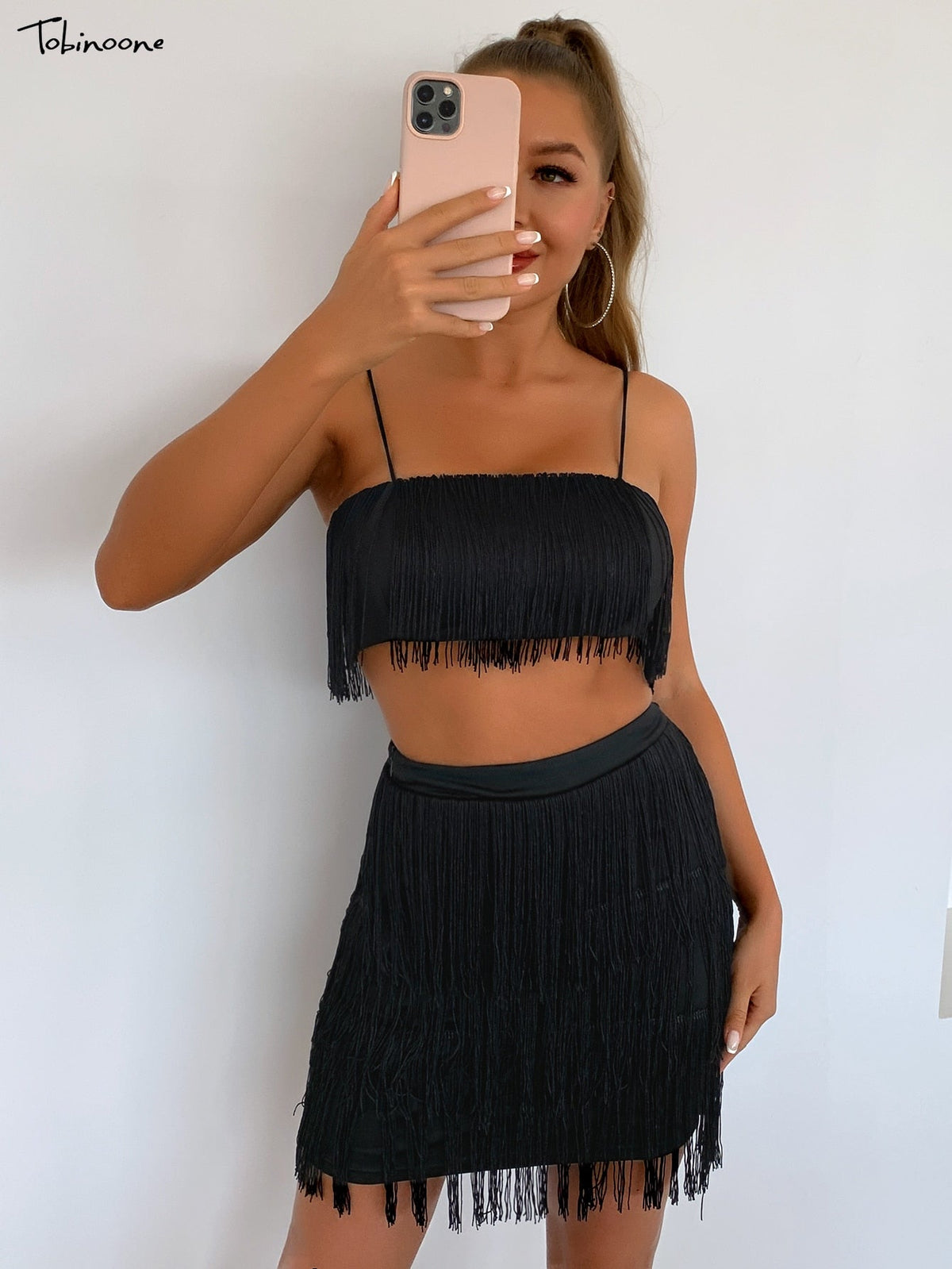 Elegant off-shoulder mini dress with tassel embellishments, ideal for summer parties, by The Clothing Company Sydney.