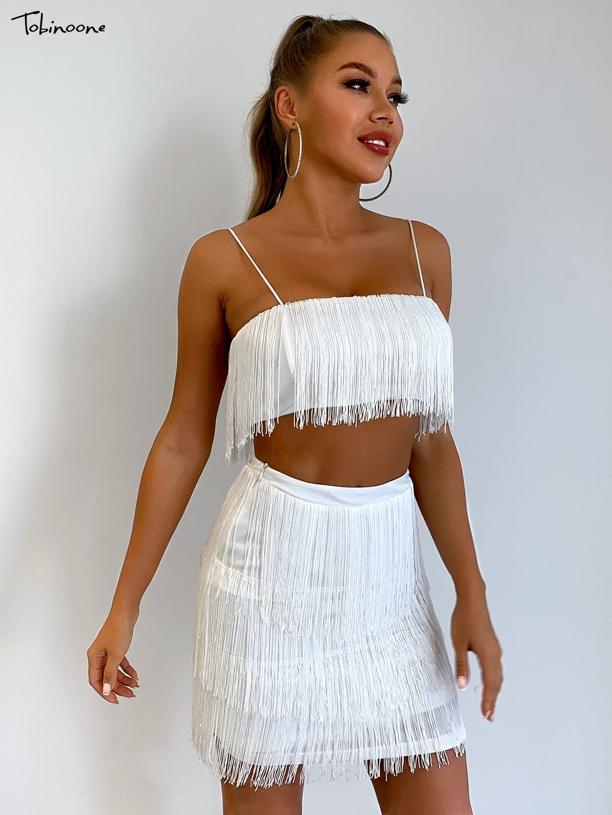 Elegant off-shoulder summer tassel mini dress by The Clothing Company Sydney with fringe embellishments for club or party wear.