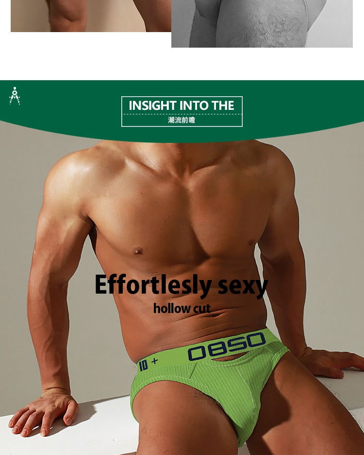 Men's low waist cotton jockstrap swim trunks with bikini-style design from The Clothing Company Sydney, shown on a model.