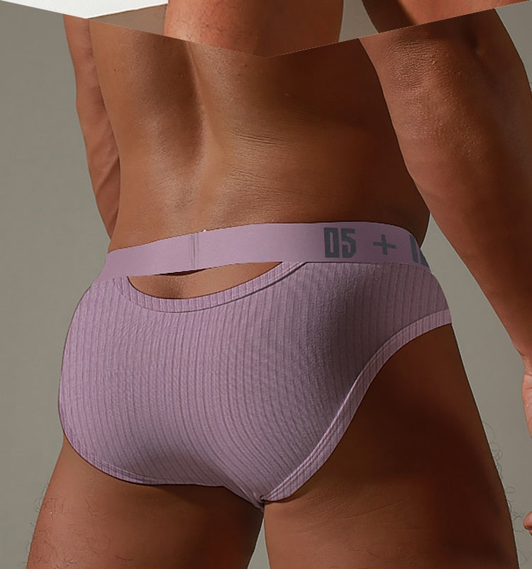 Men's low waist cotton jockstrap swim trunks from The Clothing Company Sydney, featuring a snug fit and classic bikini style.