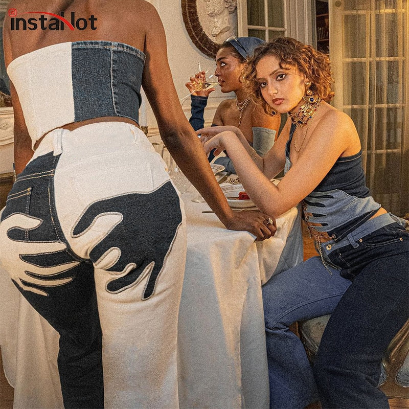 Vintage flare jeans from The Clothing Company Sydney featuring embroidery, patchwork, and casual streetwear denim style.