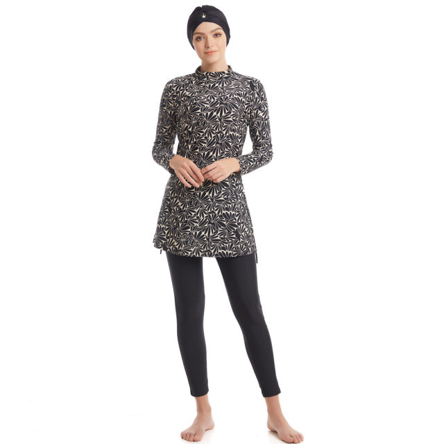 Plus size long sleeve swimsuit from The Clothing Company Sydney, full coverage swimwear with three-piece design, ideal for swimming.