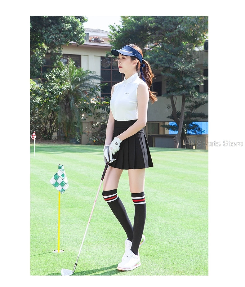 Ladies golf skirt set by The Clothing Company Sydney with sleeveless slim top and pleated dry-fit tennis or badminton skirt.