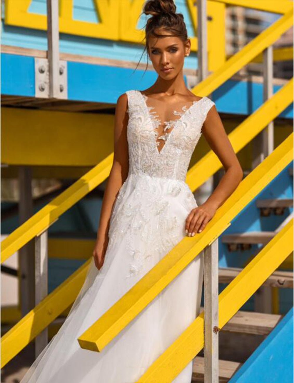 Plus size boho beach wedding dress with V-neck, lace appliques, backless design, by The Clothing Company Sydney.