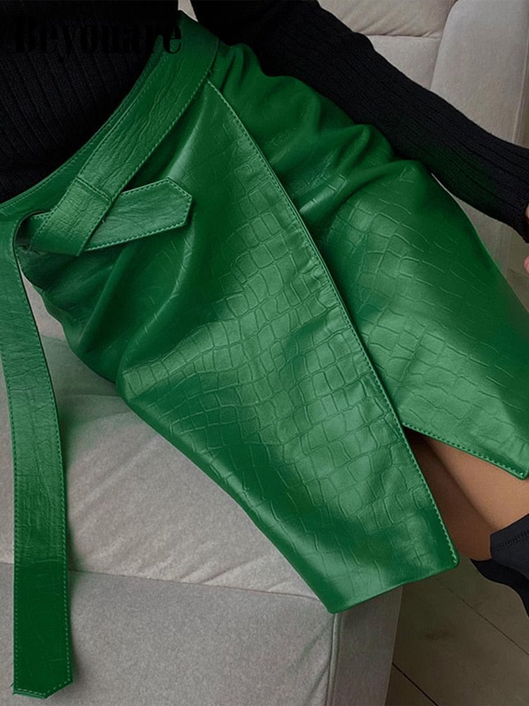 Elegant green faux leather crocodile pattern A-line skirt with high waist and split mini design from The Clothing Company Sydney.