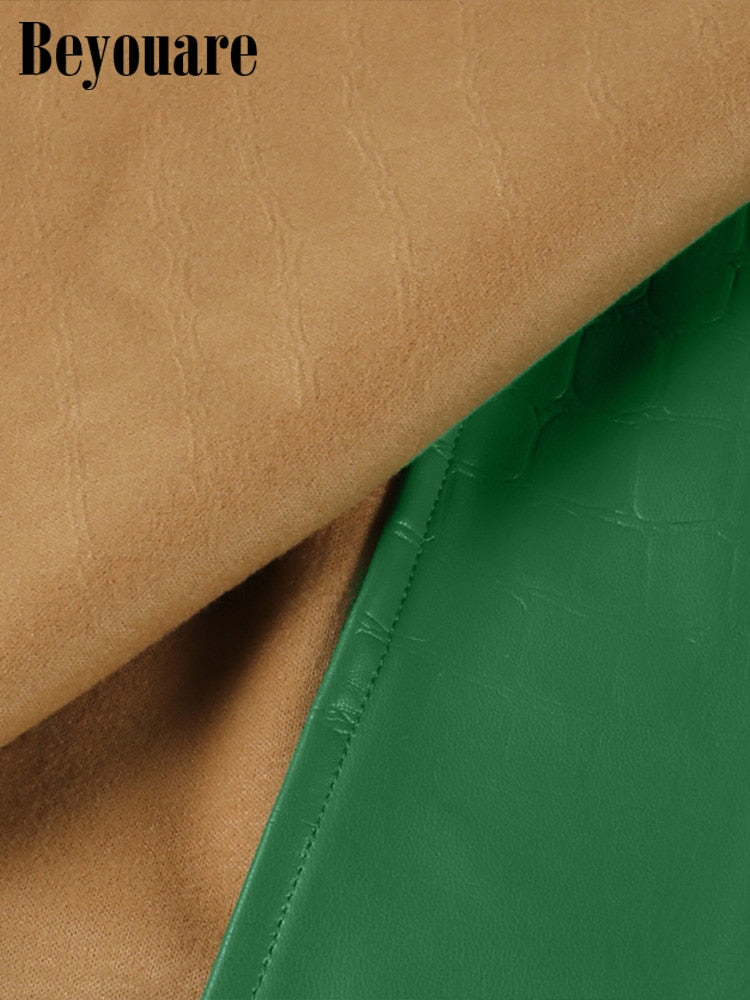 Elegant green faux leather crocodile pattern A-line skirt with high waist and split mini design, stylish and trendy for women.