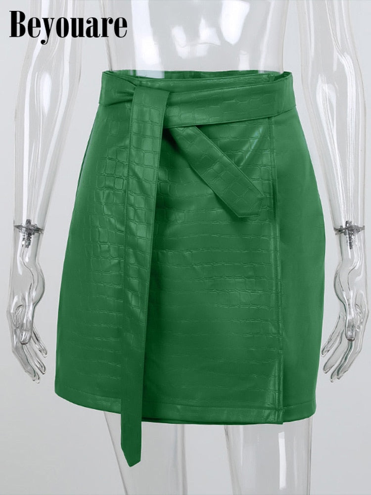 Elegant green faux leather crocodile pattern A-line skirt with high waist and split mini design, by The Clothing Company Sydney.