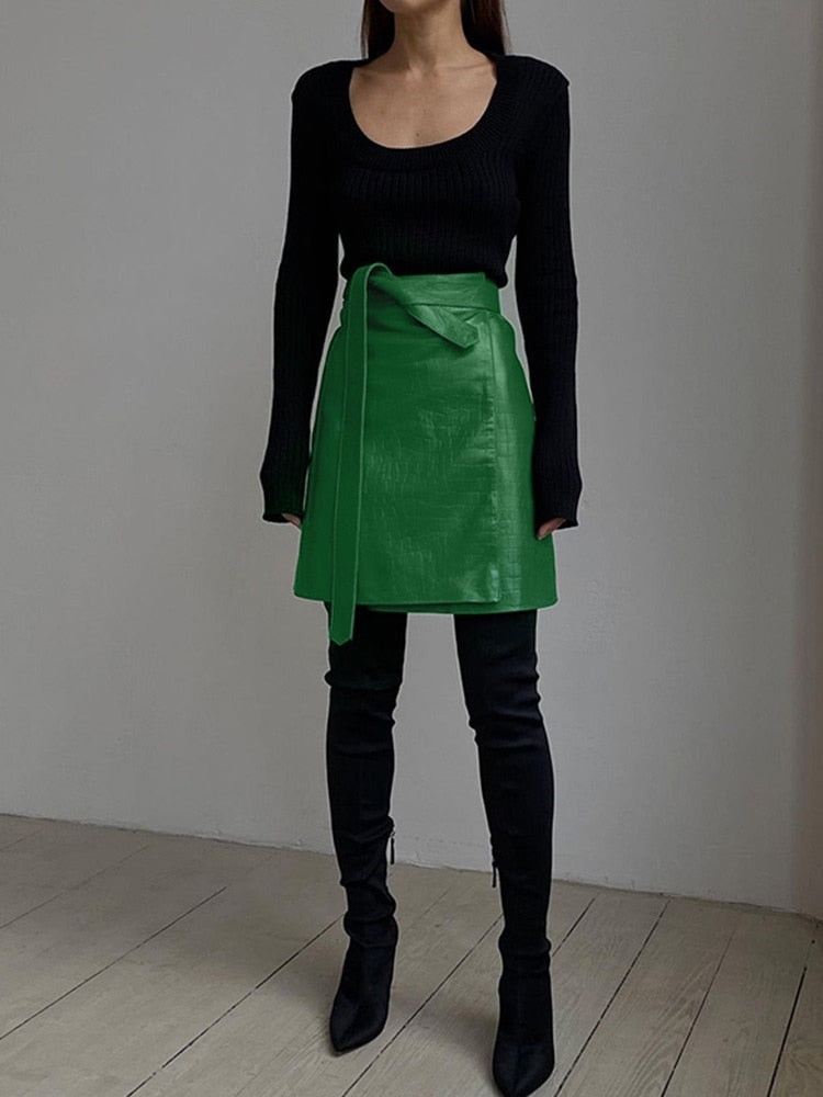 Elegant green faux leather crocodile pattern A-line high waist mini skirt with split detail, from The Clothing Company Sydney.