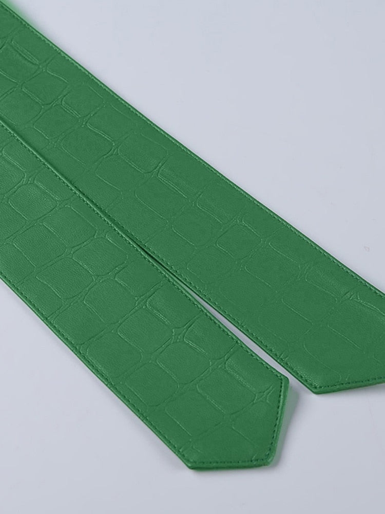 Green faux leather crocodile pattern A-line skirt with high waist and split, stylish mini skirt by The Clothing Company Sydney.