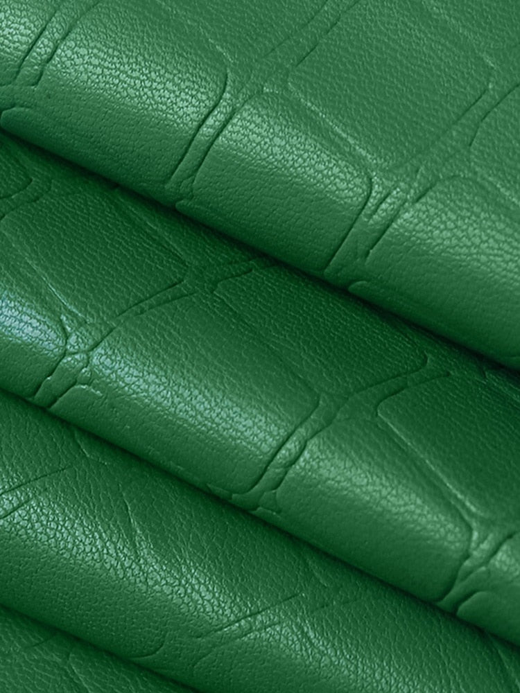 Elegant green faux leather A-line skirt with crocodile pattern, high waist, split mini design, by The Clothing Company Sydney.