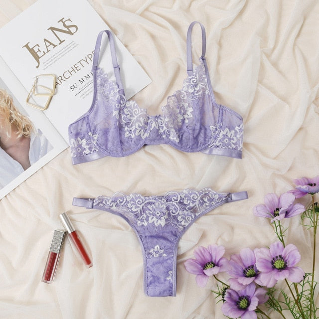 Two-piece floral embroidery lingerie set including a deep-V brief and underwire push-up bra, transparent and feminine.