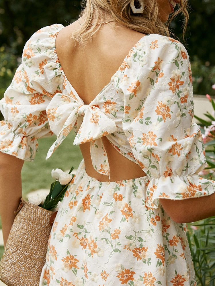 White cotton summer dress with lace-up front, hollow out design, high waist, ruffles, and A-line silhouette by The Clothing Company Sydney