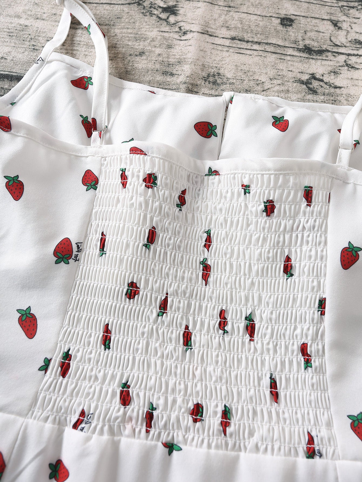 White chiffon boho maxi dress with strawberry print, spaghetti straps, sleeveless design, perfect for summer beach wear.