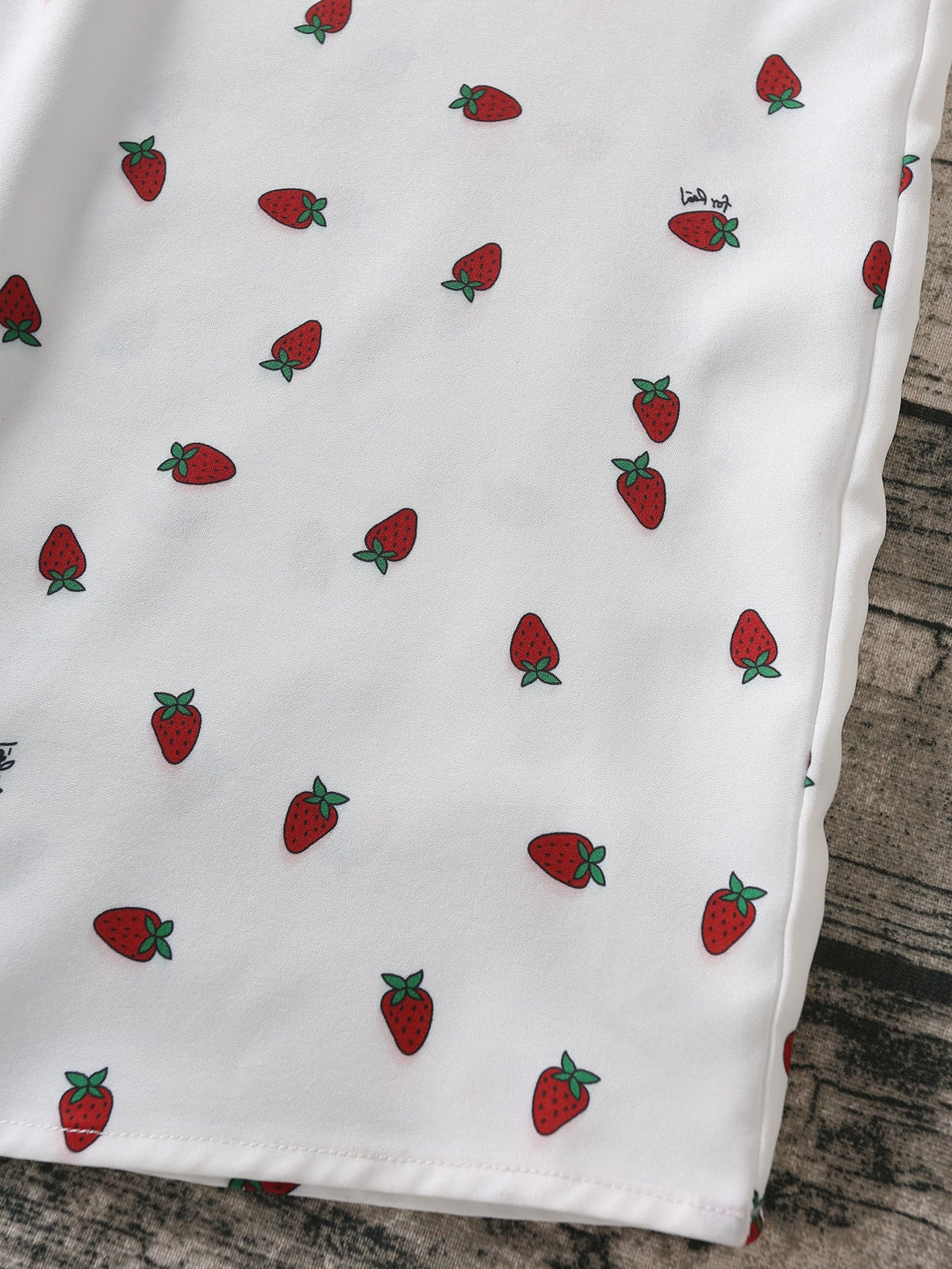 Strawberry print white chiffon boho maxi dress with spaghetti straps and sleeveless design for summer beachwear, by The Clothing Company Sydney.