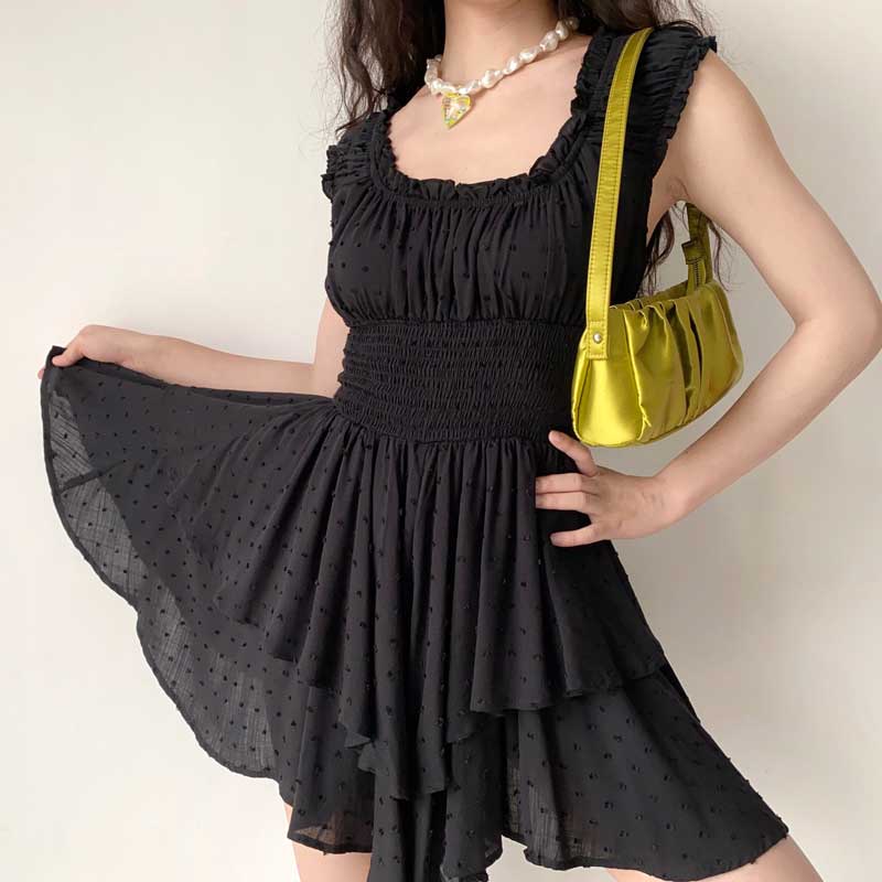 Boho-inspired rayon mini summer dress with ruffled neckline, tiered skirt, puff sleeves, and shirred details by The Clothing Company Sydney.