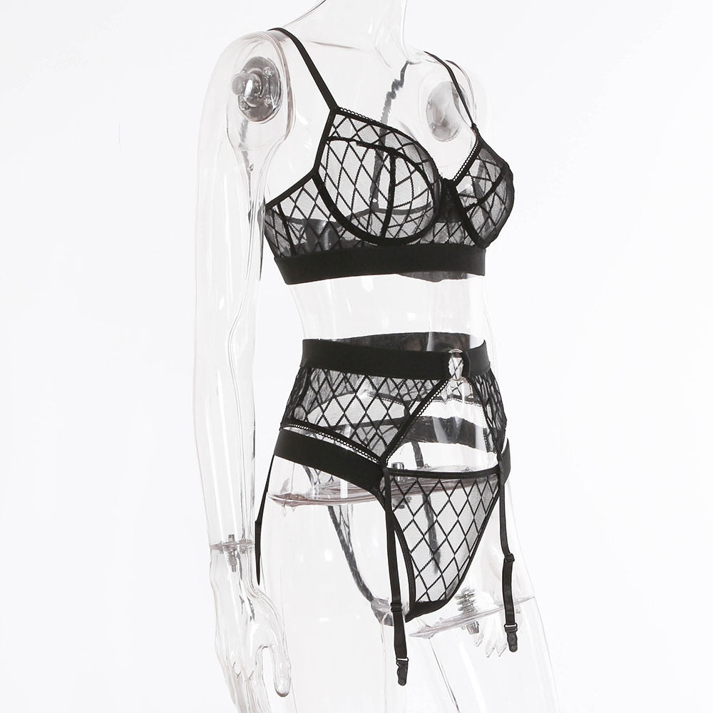Black plaid lingerie set with lace bra and matching panties, featuring garter straps and transparent details from The Clothing Company Sydney.