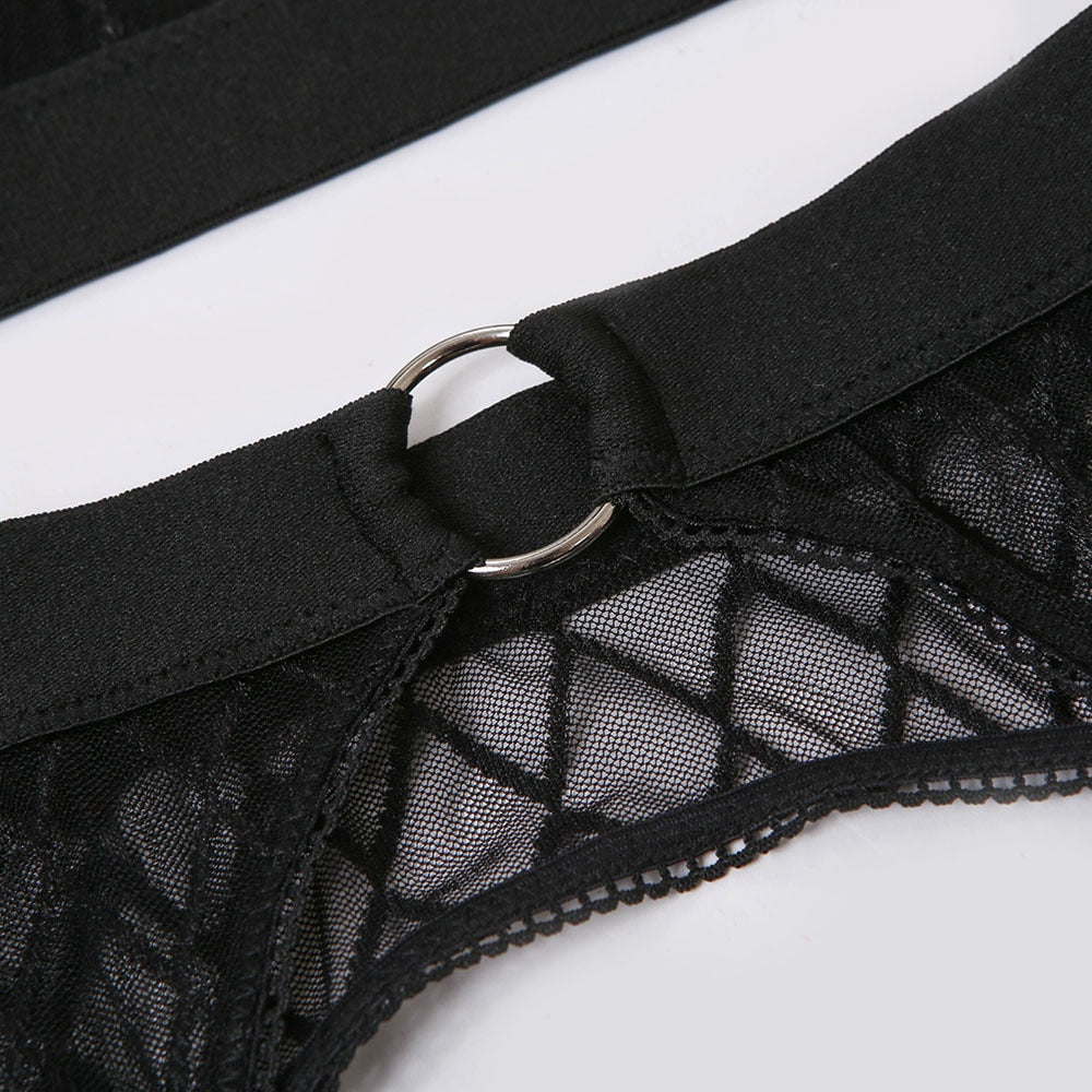 Black plaid underwear brief set by The Clothing Company Sydney, includes lace bra, panties, and transparent garter lingerie.