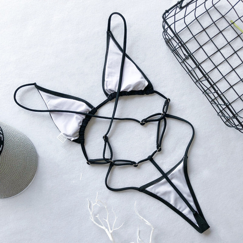 Backless high cut out G string swimsuit by The Clothing Company Sydney, featuring a micro thong design and one-piece style.