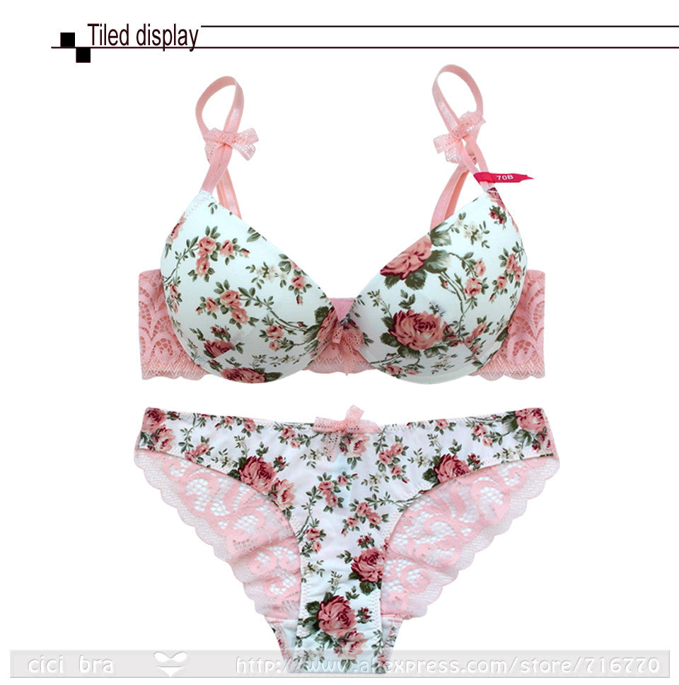 Silk lace floral push-up bra and hollow-out panties set by The Clothing Company Sydney, featuring delicate lace and bow accents.