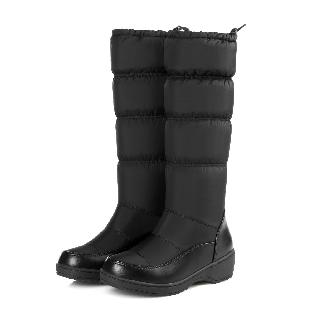 Below knee high snow boots from The Clothing Company Sydney featuring round toe and soft PU leather material.