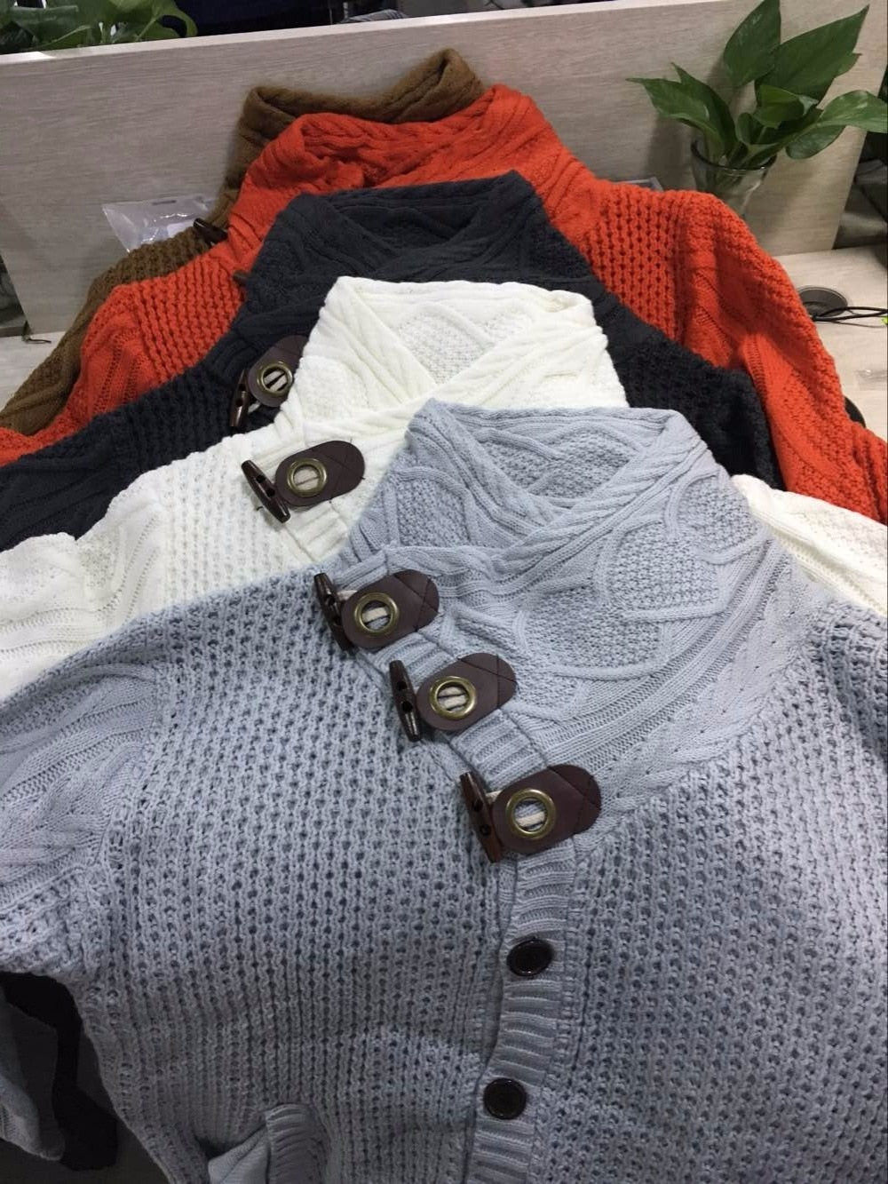 Loose fit knitted cardigan from The Clothing Company Sydney, casual button-up sweater with relaxed style and soft knit fabric.