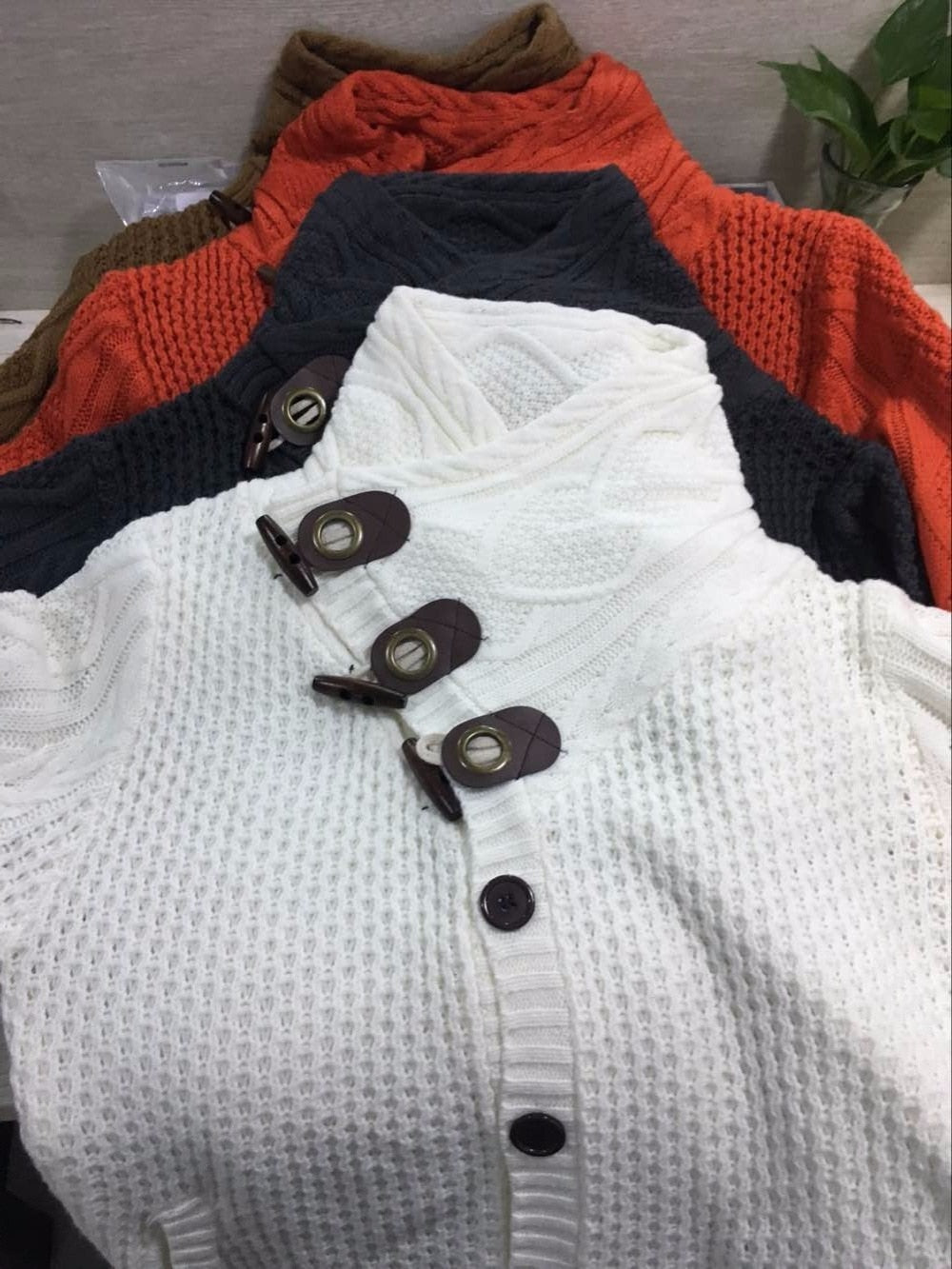 Loose fit knitted cardigan from The Clothing Company Sydney featuring button-up casual design, perfect for everyday tops.