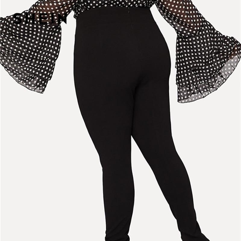 Black high waist pencil pants with double breasted design and zipper closure, plus size trousers from The Clothing Company Sydney.