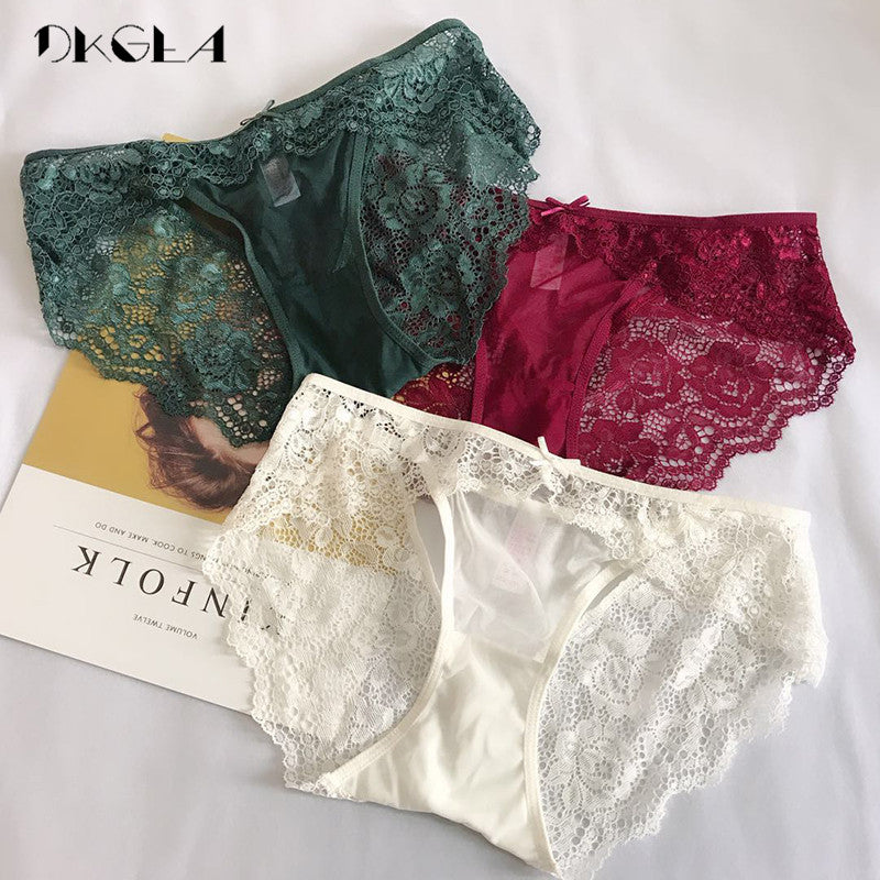 Three-piece set of low-rise lace underwear featuring white, green, and red transparent briefs with embroidery by The Clothing Company Sydney.