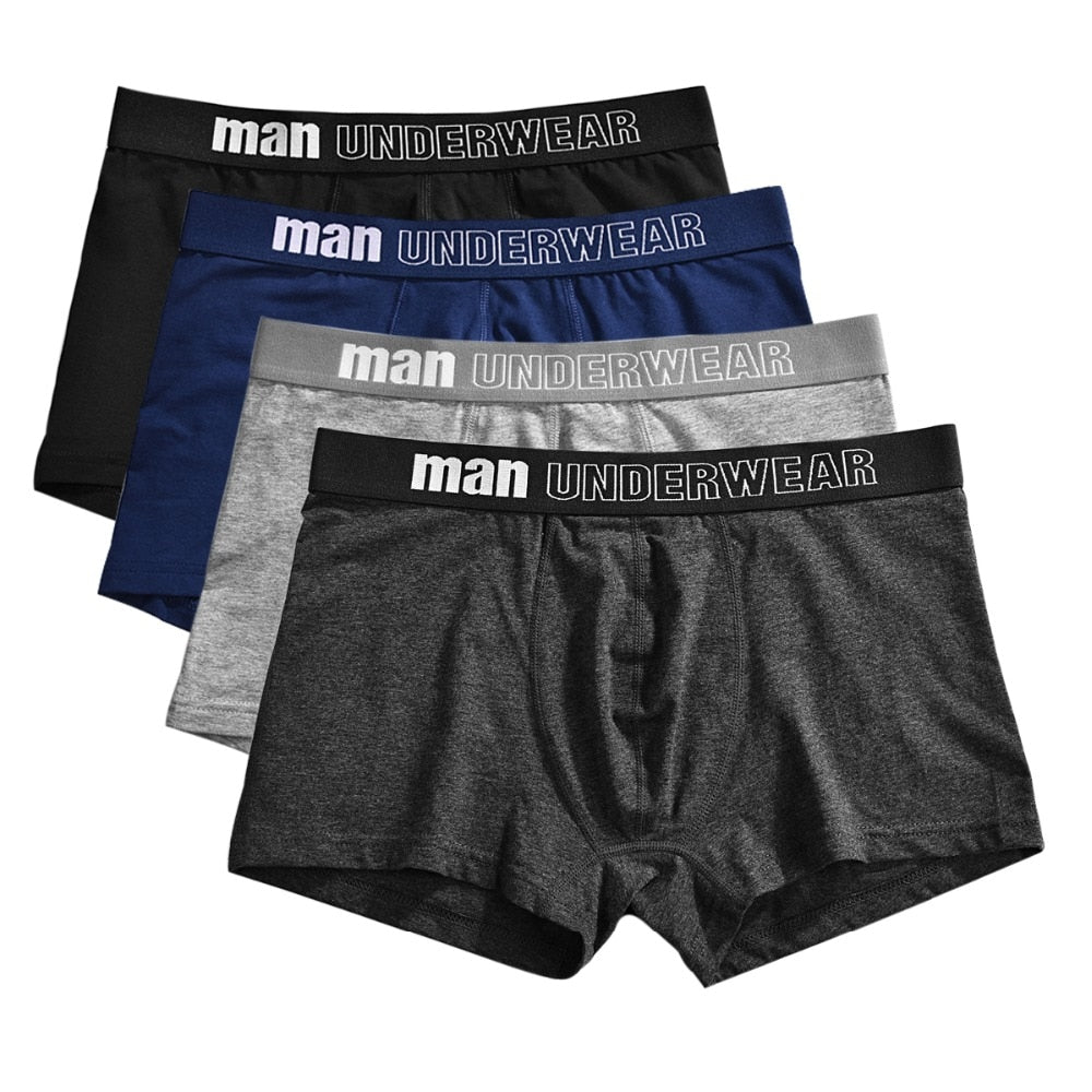 Four-pack men's cotton boxer underwear from The Clothing Company Sydney, breathable and flexible solid color boxer shorts for men.