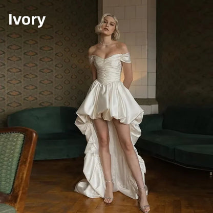 Satin off-shoulder bridal wedding dress with ruched bodice, lace-up back, short front and long train