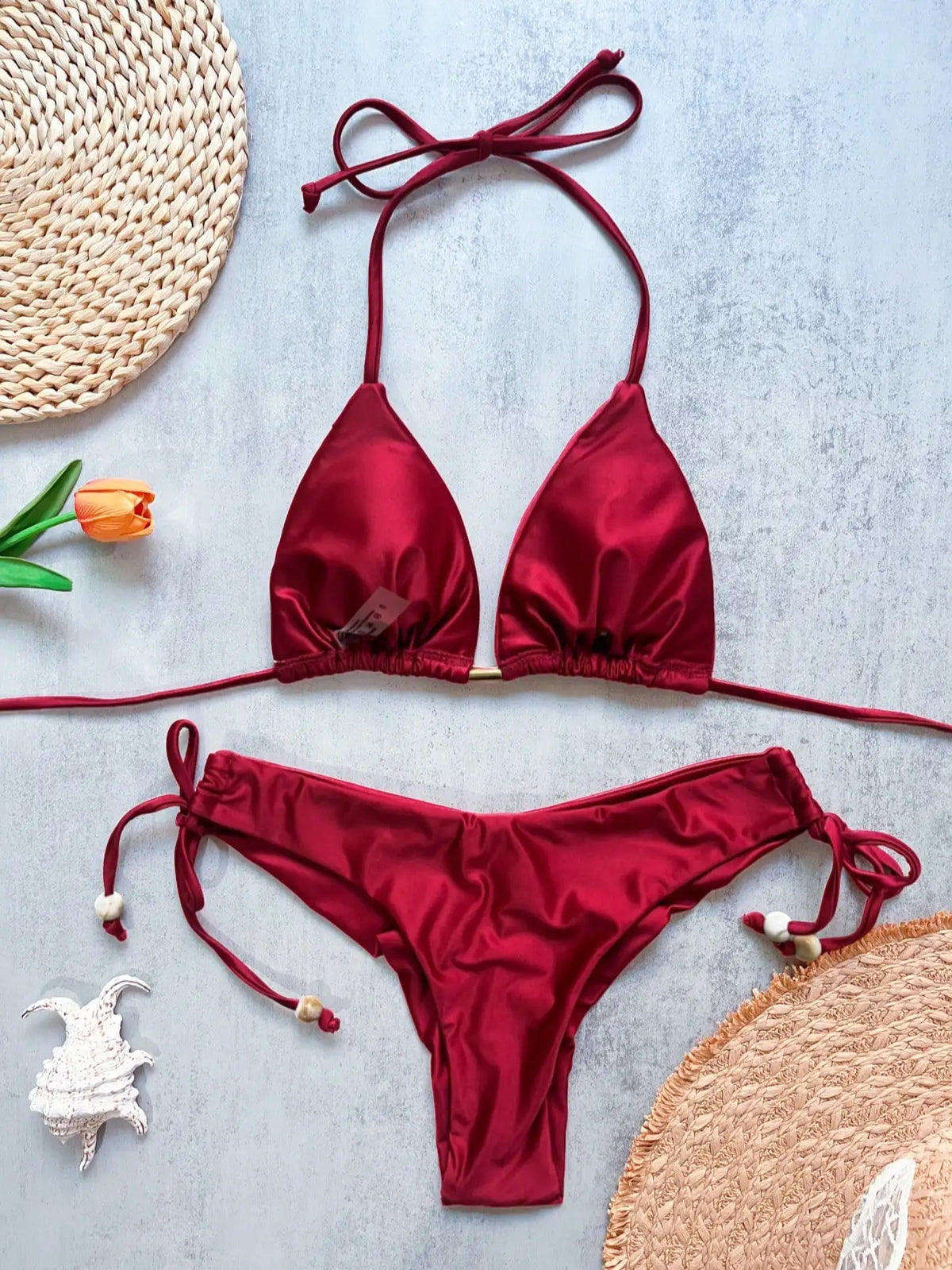 Two-piece micro bikini set for women featuring triangle tops and bottoms, ideal for beachwear and swimming by The Clothing Company Sydney.