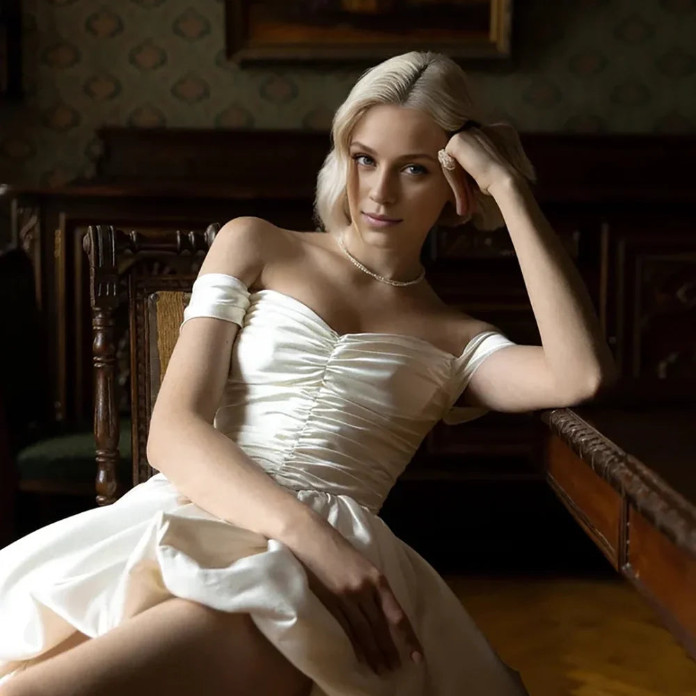 Satin off-shoulder bridal gown with ruched bodice, lace-up back, short front and long train wedding dress