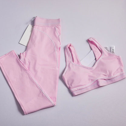 Women's two-piece striped yoga set with leggings and breathable crop top for workouts and running