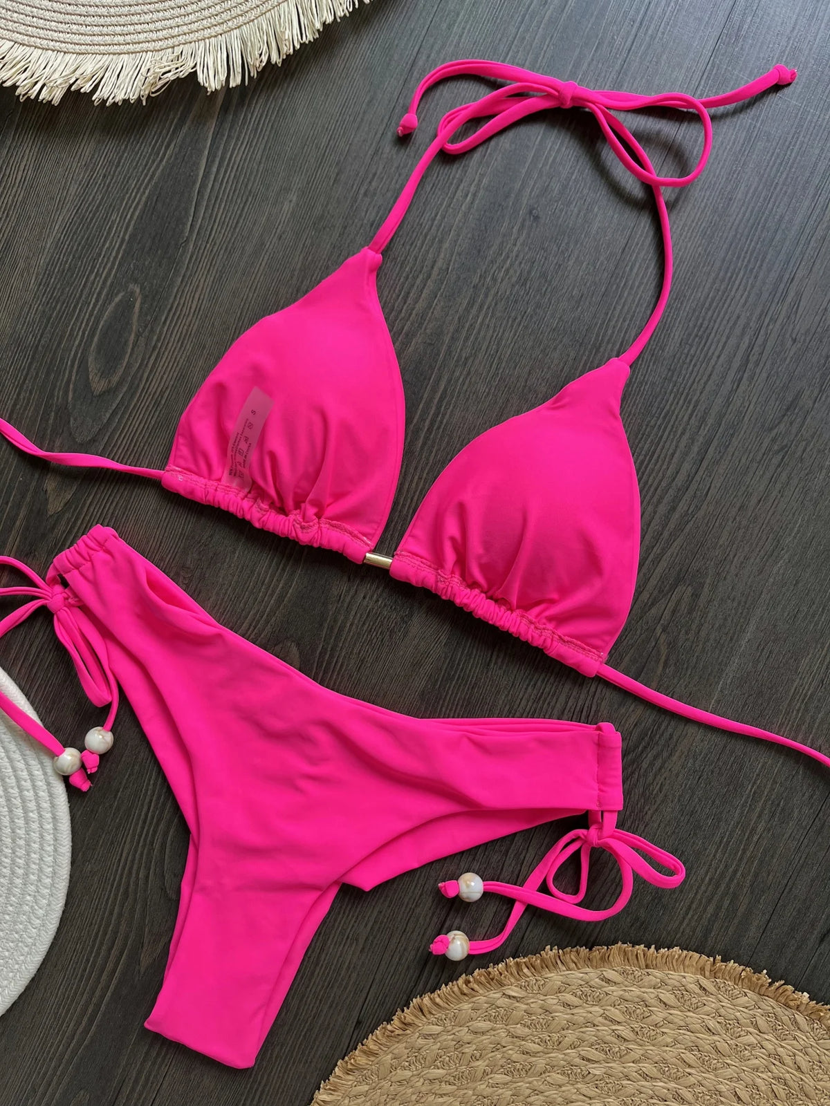 Two-piece foldable micro bikini set by The Clothing Company Sydney, featuring triangle swimwear design for beachwear and swimming.