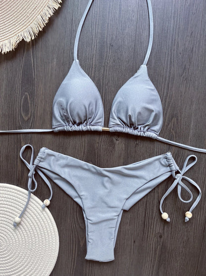 Two-piece foldable micro bikini swimsuit for women featuring triangle tops and beachwear from The Clothing Company Sydney.