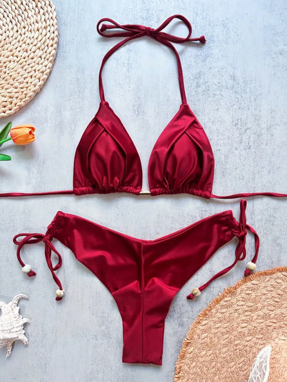 Two-piece micro bikini set for women with triangle swimwear design, featuring minimal coverage and vibrant beach-ready style.