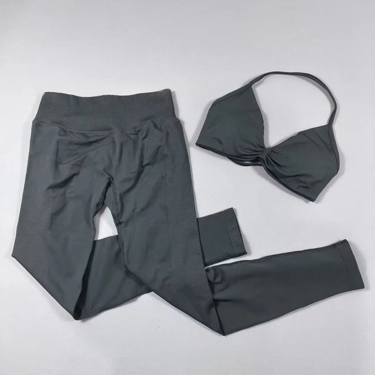 Women's seamless yoga set with halter neck sports bra and high-waisted lifting leggings by The Clothing Company Sydney