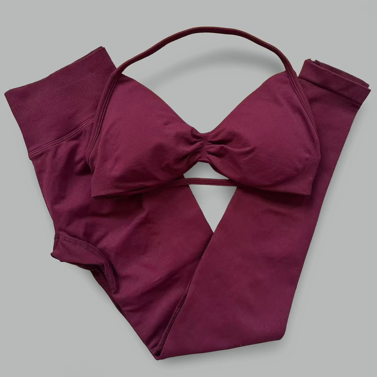 Women's seamless yoga set with halter sports bra and high-waisted lifting leggings by The Clothing Company Sydney